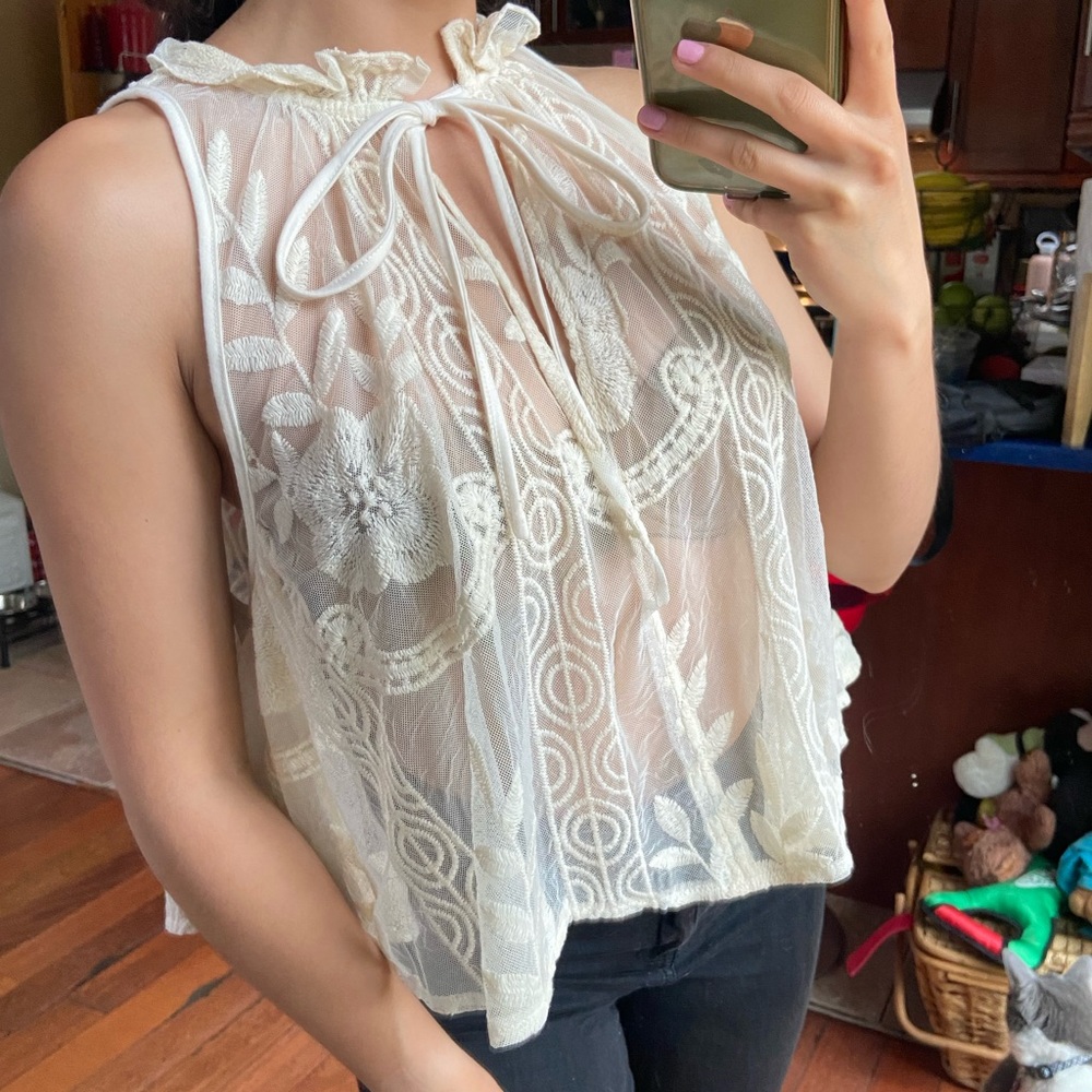 Size large, off-white, mesh top. Perfect condition!